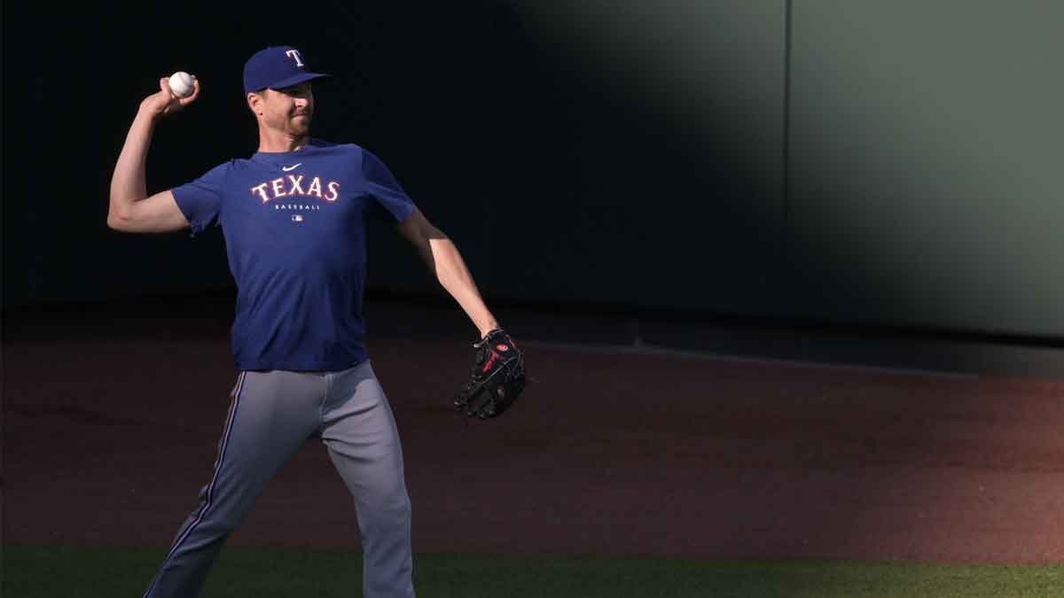 May 26, 2023; Baltimore, Maryland, USA; Texas Rangers starting pitch Jacob deGrom throws in the outfield before the game against the Baltimore Orioles at Oriole Park at Camden Yards. 