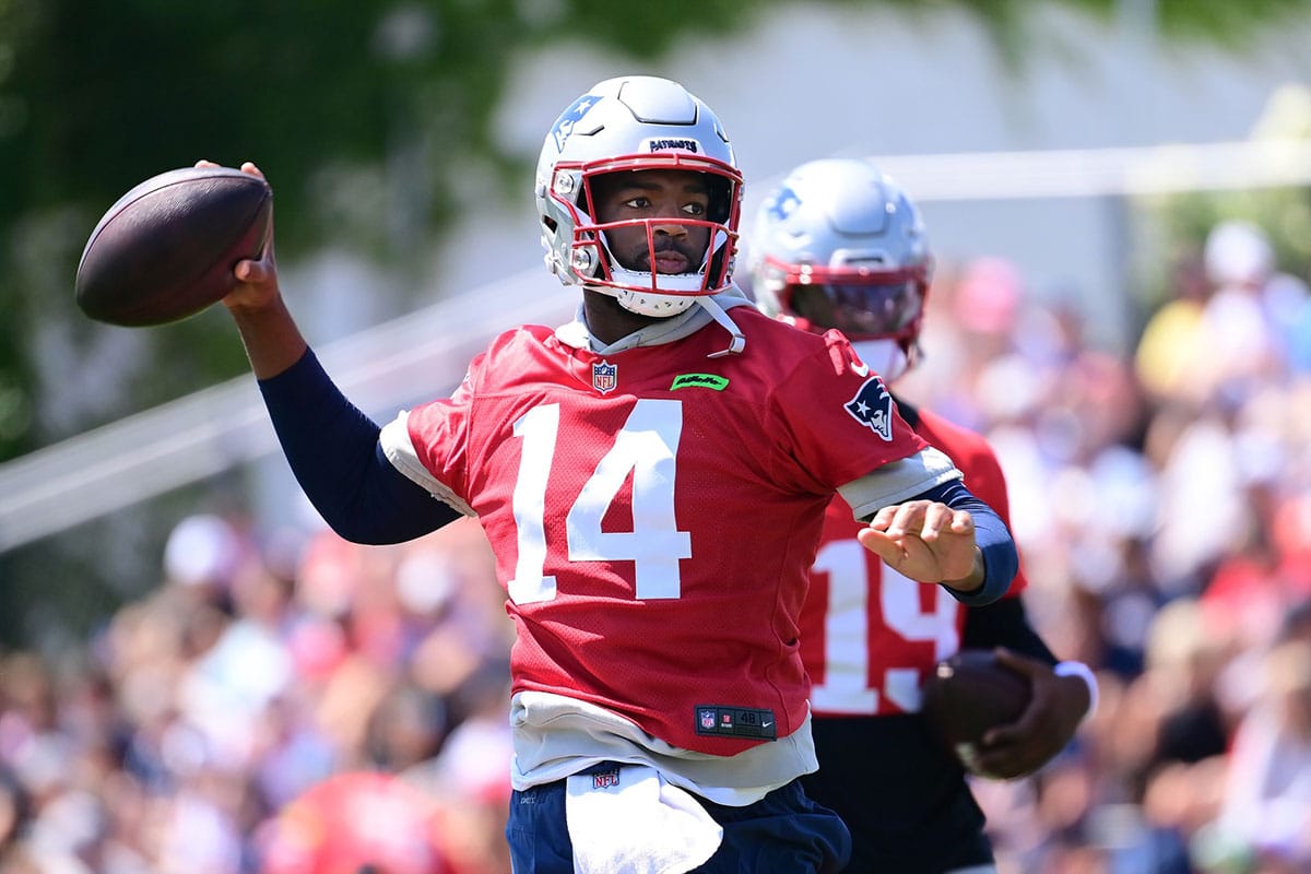 New England Patriots quarterback Jacoby Brissett (14) throws a pass during training camp at Gillette Stadium. 