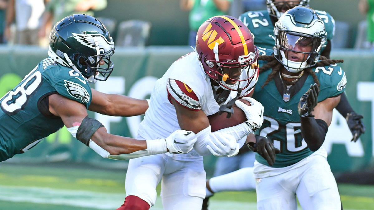 Washington Commanders wide receiver Jahan Dotson (1) catches touchdown pass against Philadelphia Eagles cornerback Josh Jobe (28) and safety Terrell Edmunds (26) during the fourth quarter at Lincoln Financial Field.