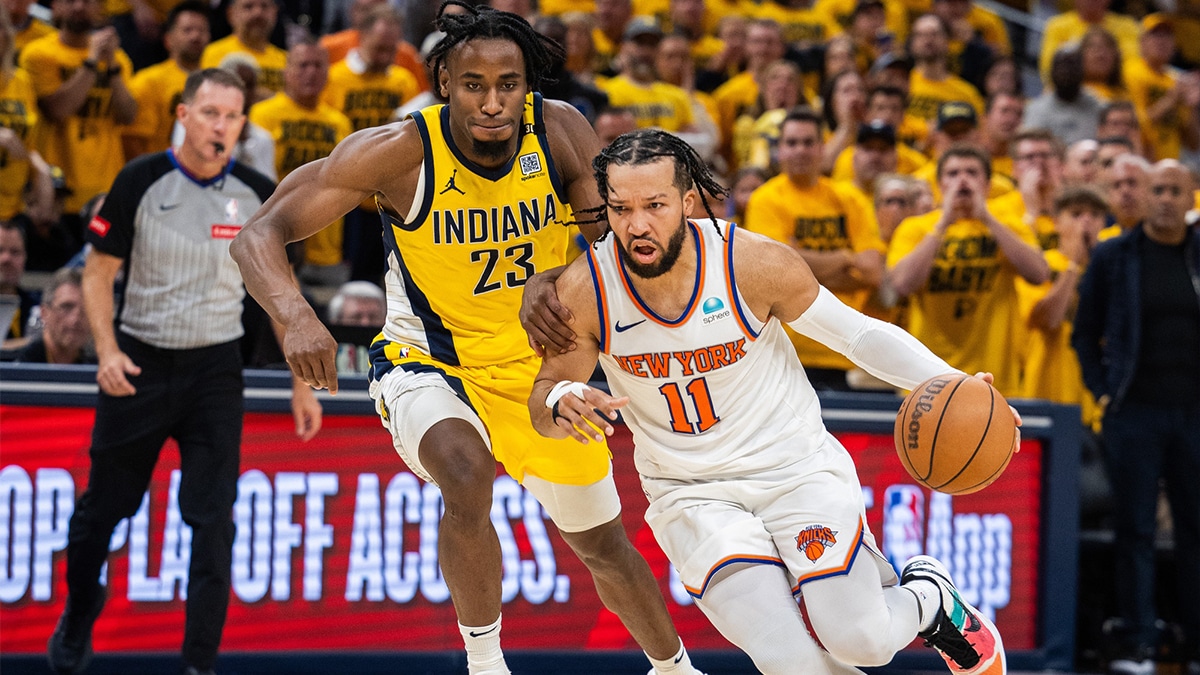 New York Knicks guard Jalen Brunson (11) dribbles the ball while Indiana Pacers forward Aaron Nesmith (23) defends during game three of the second round for the 2024 NBA playoffs at Gainbridge Fieldhouse. 