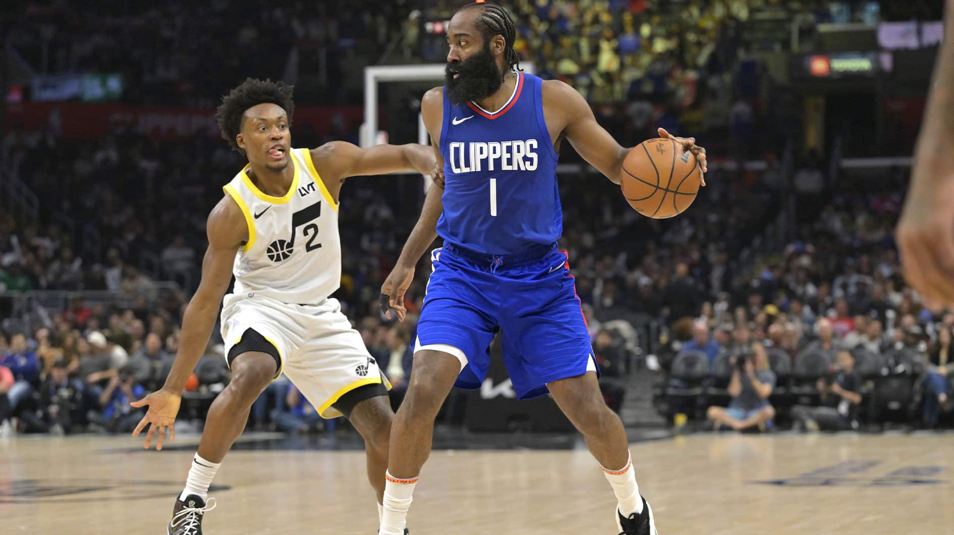 James Harden (1) touches the ball in front of Utah Jazz guard Collin Sexton