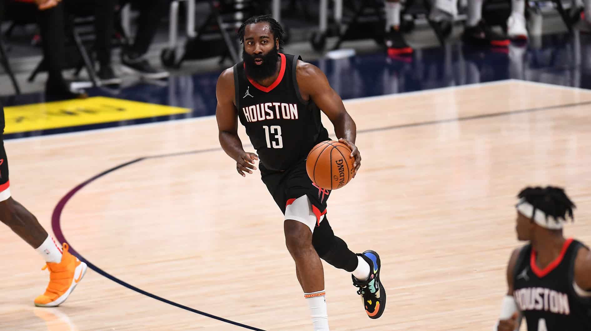 James Harden (13) dribbles up court