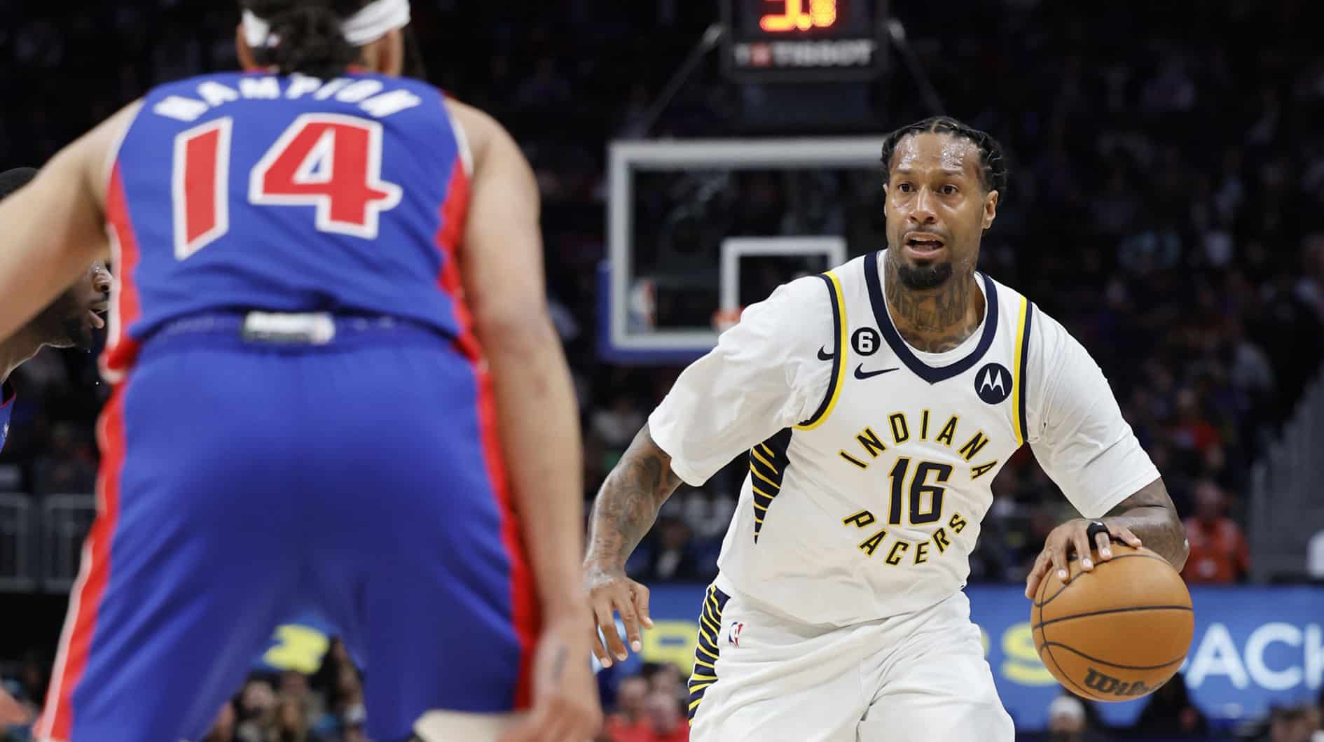 Indiana Pacers forward James Johnson (16) dribbles the ball against Detroit Pistons guard R.J. Hampton (14) in the second half at Little Caesars Arena. 