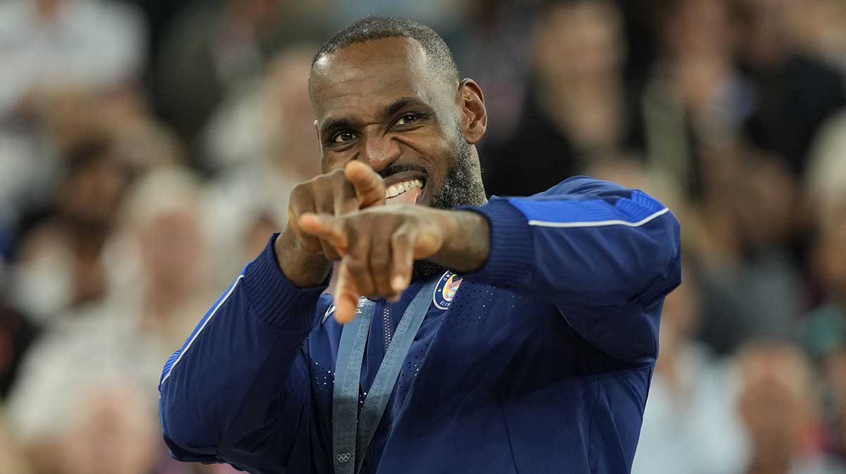 United States guard LeBron James (6) celebrates with the gold medal after the game against France in the men's basketball gold medal game during the Paris 2024 Olympic Summer Games at Accor Arena.