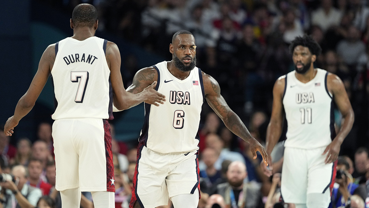 United States guard LeBron James (6) celebrates with United States guard Kevin Durant (7) during the first half in a men's basketball semifinal game during the Paris 2024 Olympic Summer Games at Accor Arena.