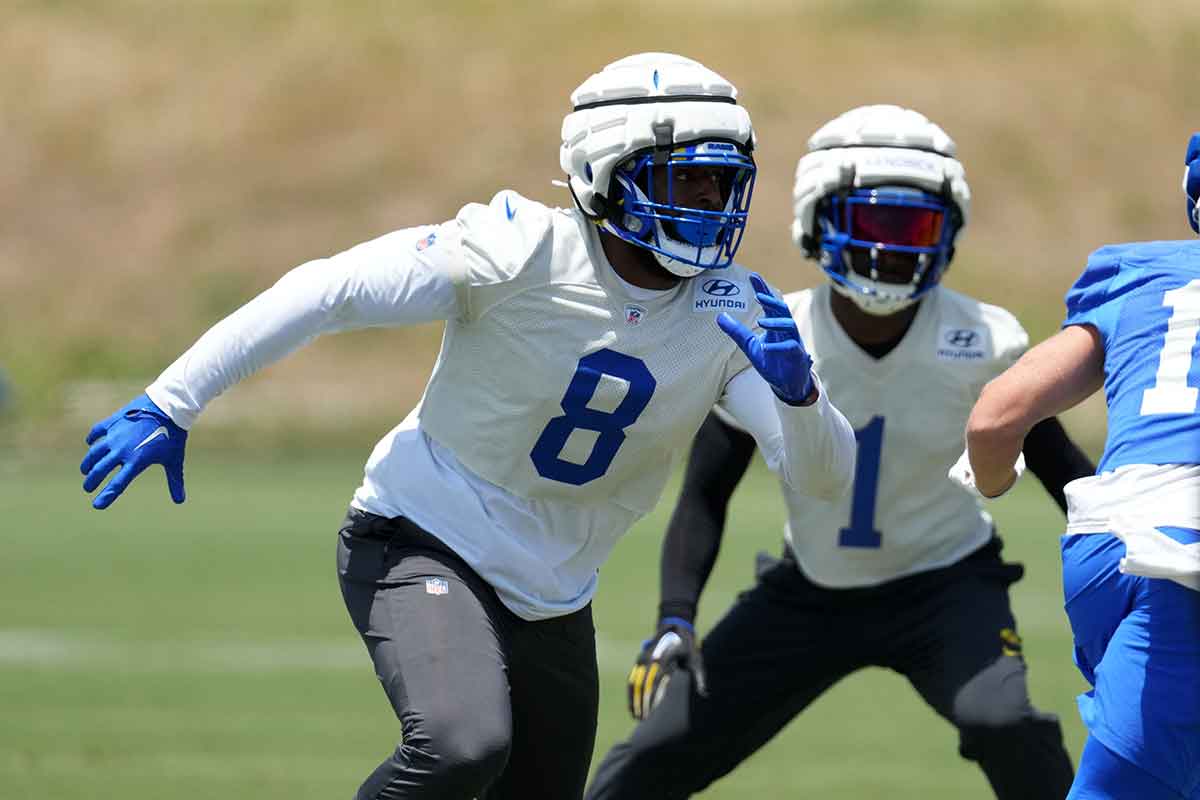 Los Angeles Rams defensive end Jared Verse (8) wears a Guardian helmet cap during organized team activities at Cal Lutheran University.