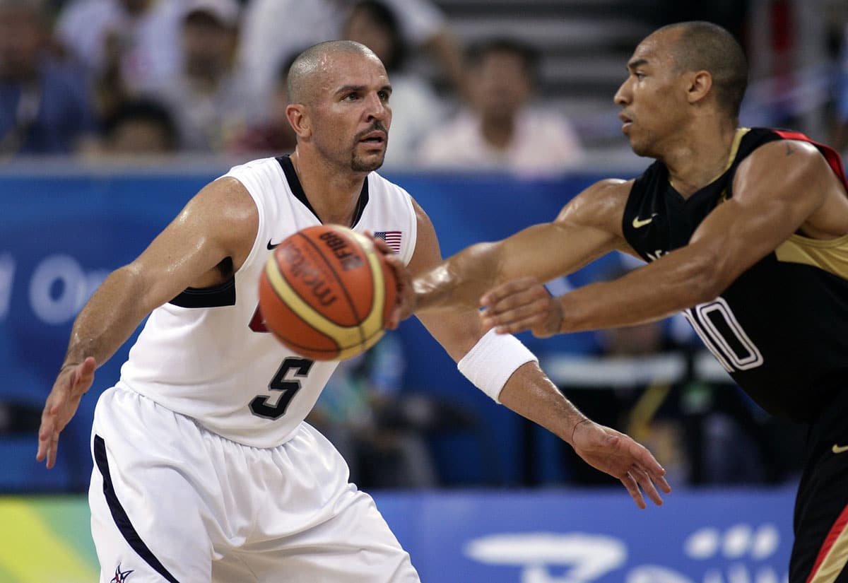 Germany guard Demond Greene (10) passes the ball away from USA guard Jason Kidd (5) during a preliminary round game at the Beijing Olympic Basketball Gymnasium during the 2008 Beijing Olympic Games. USA beat Germany 106-57.