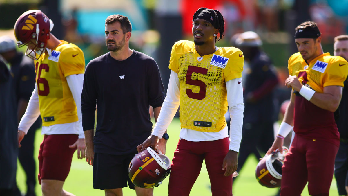 Washington Commanders quarterback Jayden Daniels (5) looks on during joint practice with the Miami Dolphins at Baptist Health Training Complex.