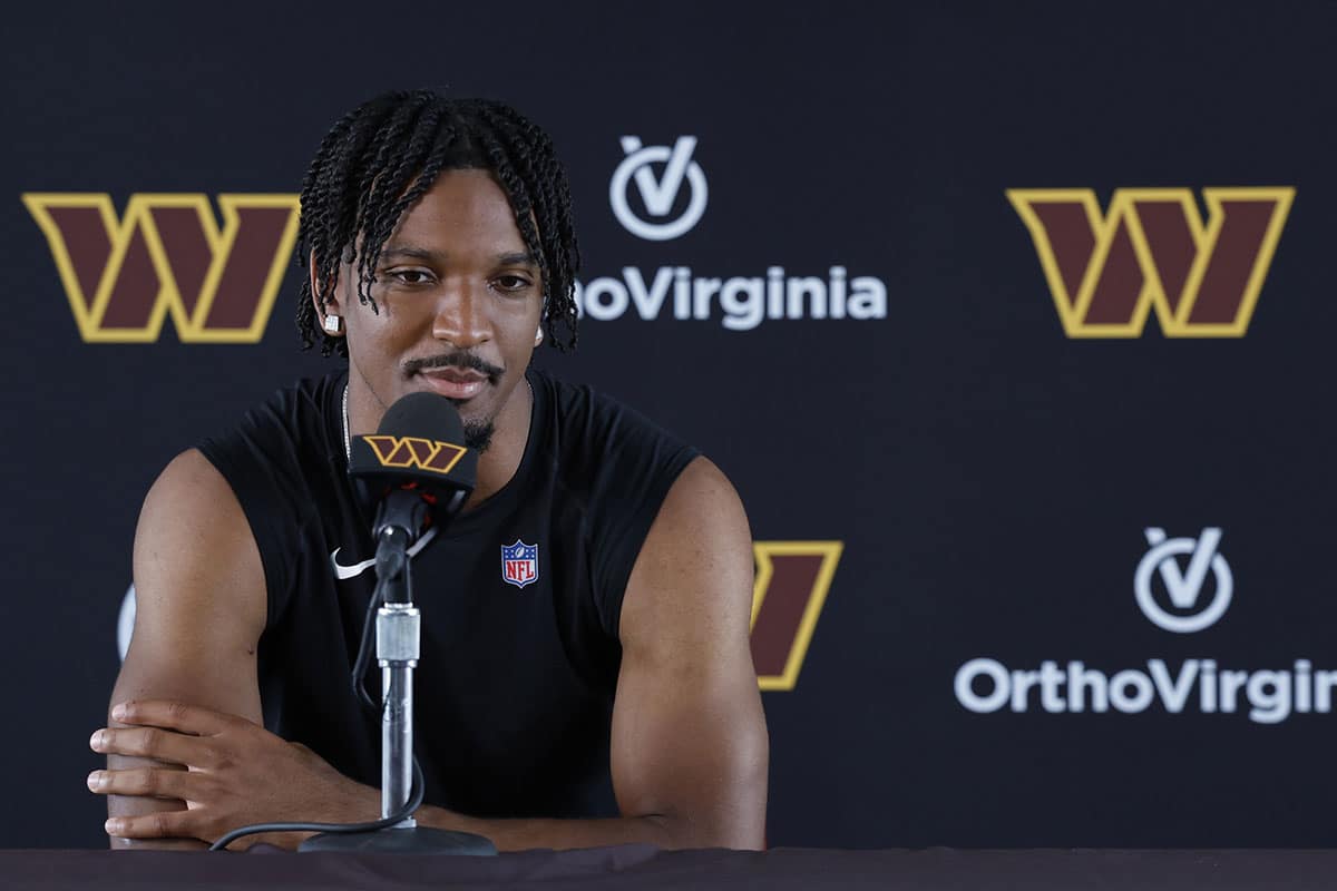 Washington Commanders quarterback Jayden Daniels speaks with the media after morning practice on day three of training camp at Commanders Park.