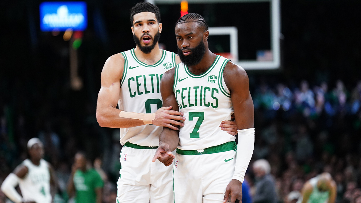 Jayson Tatum (0) and guard Jaylen Brown (7) on the court