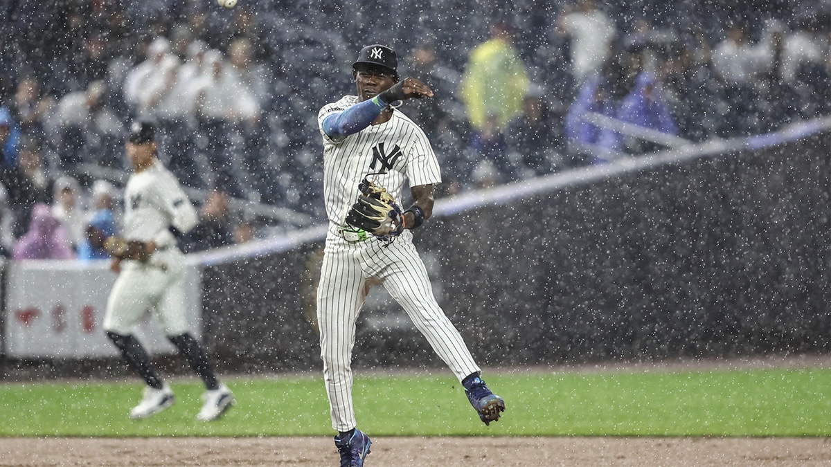 New York Yankees third baseman Jazz Chisholm Jr. (13) makes a running throw to first base in the ninth inning against the Los Angeles Angels at Yankee Stadium. 