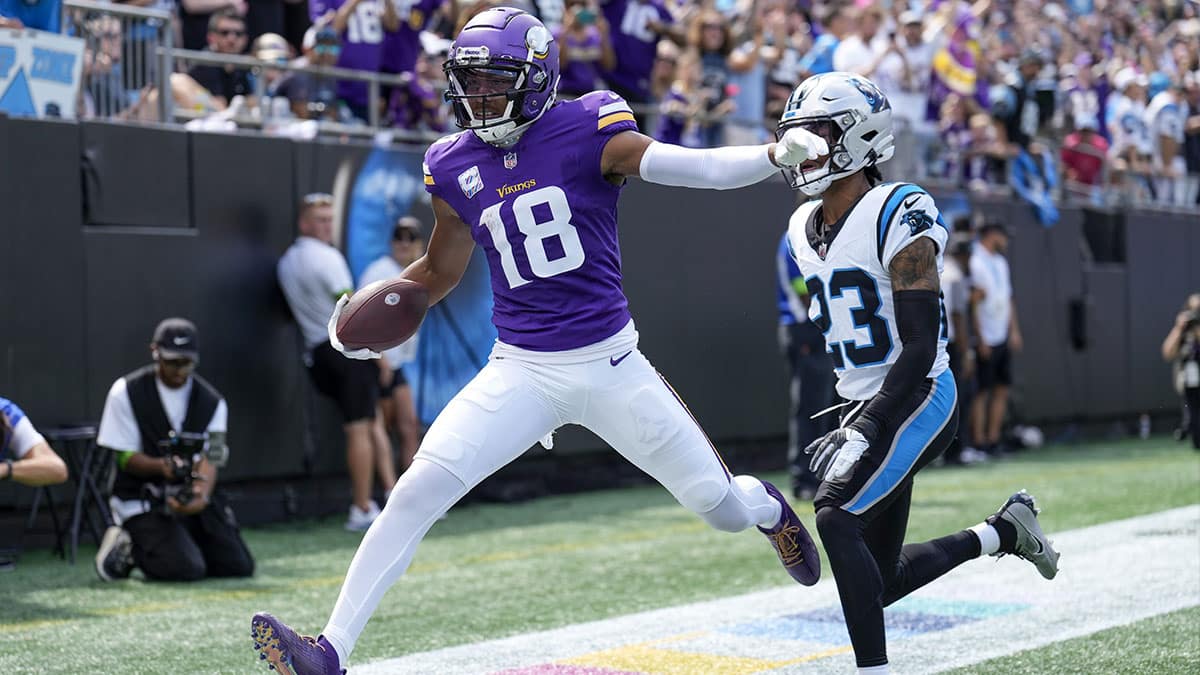 Minnesota Vikings wide receiver Justin Jefferson (18) in the end zone past Carolina Panthers cornerback CJ Henderson (23) during the first quarter at Bank of America Stadium. 