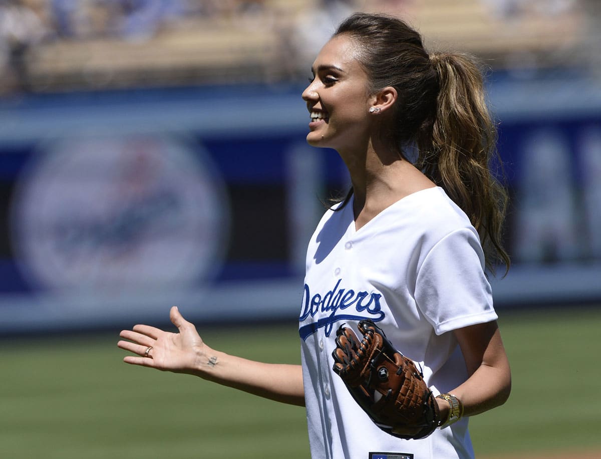 Jessica Alba throwing out first pitch at Los Angeles Dodgers game on August 17, 2014.