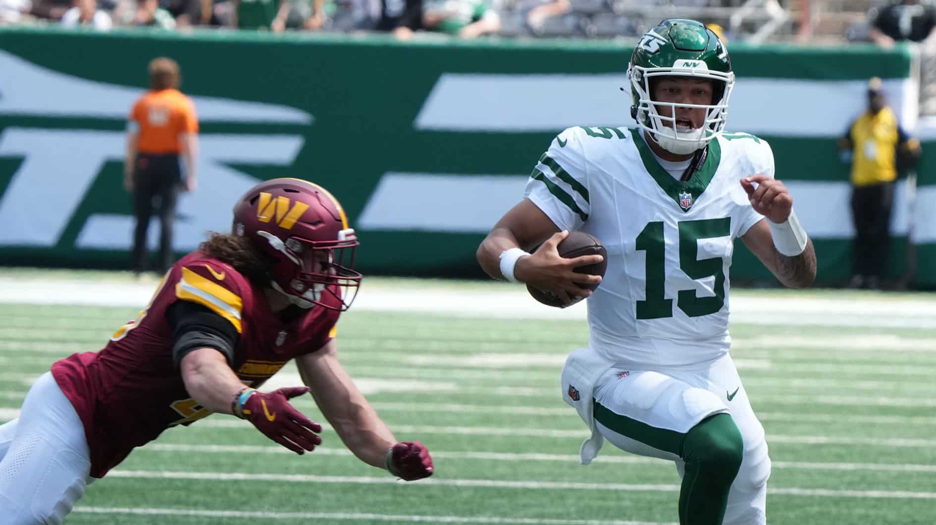 Jets QB Adrian Martinez runs for a first down late in the second half as the Washington Commanders came to MetLife Stadium to play the Jets in the first preseason game of the 2024 season. The Jets topped the Commanders 20-17.