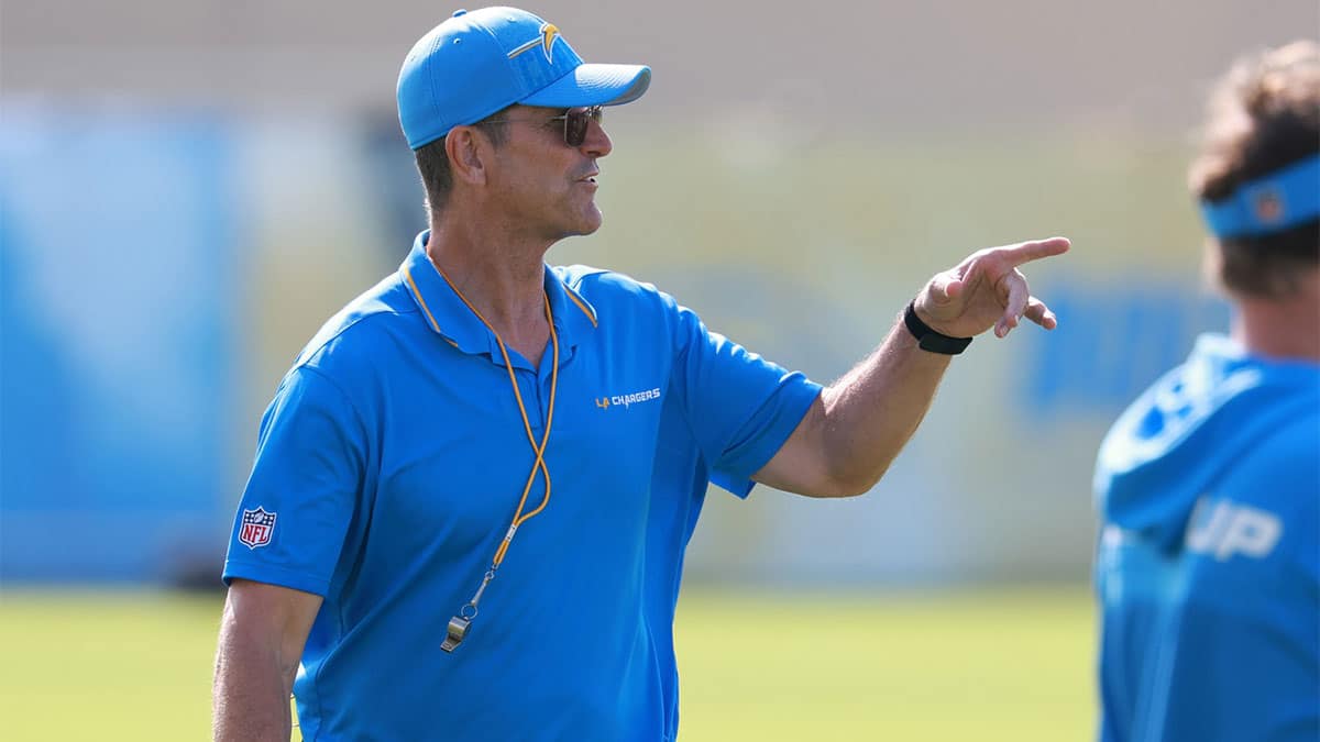 Los Angeles Chargers head coach Jim Harbaugh instructs on the field during the first day of training camp at The Bolt.