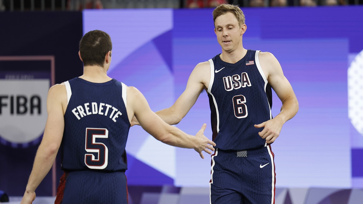 United States player Canyon Barry (6) greets Jimmer Fredette (5) before the men’s pool basketball 3x3 game against Serbia during the Paris 2024 Olympic Summer Games at La Concorde 1. 