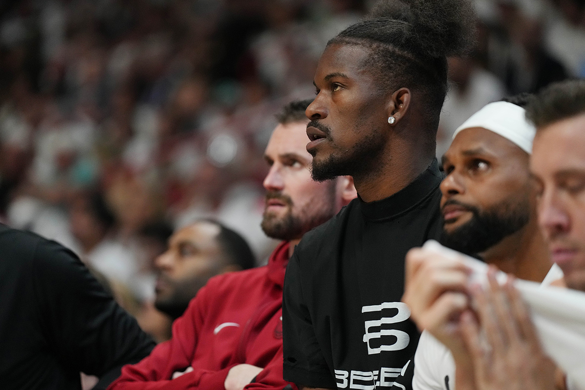 Miami Heat forward Jimmy Butler (22) watches from the bench during the first half of Game 3 of the first round of the 2024 NBA Playoffs against the Boston Celtics at Kaseya Center. 