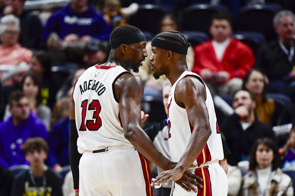 Miami Heat forward Jimmy Butler (22) and center/forward Bam Adebayo (13) talk before a free-throw shot against the Utah Jazz during the second half at Vivint Arena.