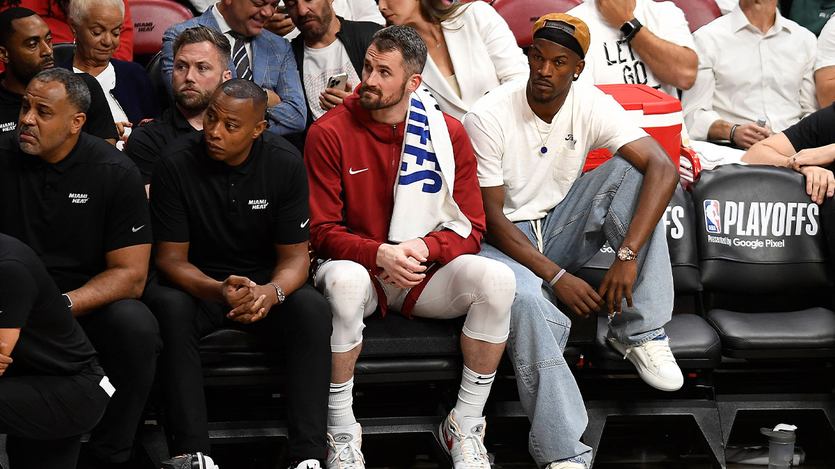 Miami Heat forward Kevin Love (42) and Jimmy Butler (22) watch the Heat fall to the Boston Celtics during the fourth quarter of game four of the first round for the 2024 NBA playoffs at Kaseya Center. Brian Windhorst has made comments about Butler's future with the Heat.