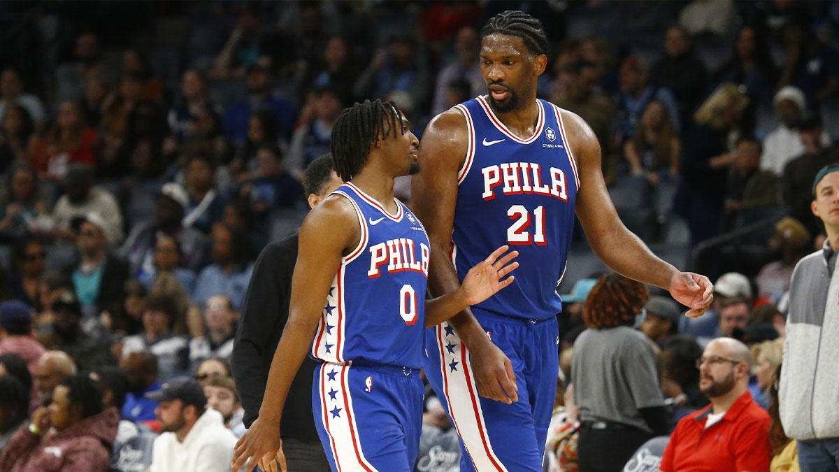 Philadelphia 76ers guard Tyrese Maxey (0) and center Joel Embiid (21) talk as they walk off the court at half time against the Memphis Grizzlies at FedExForum.