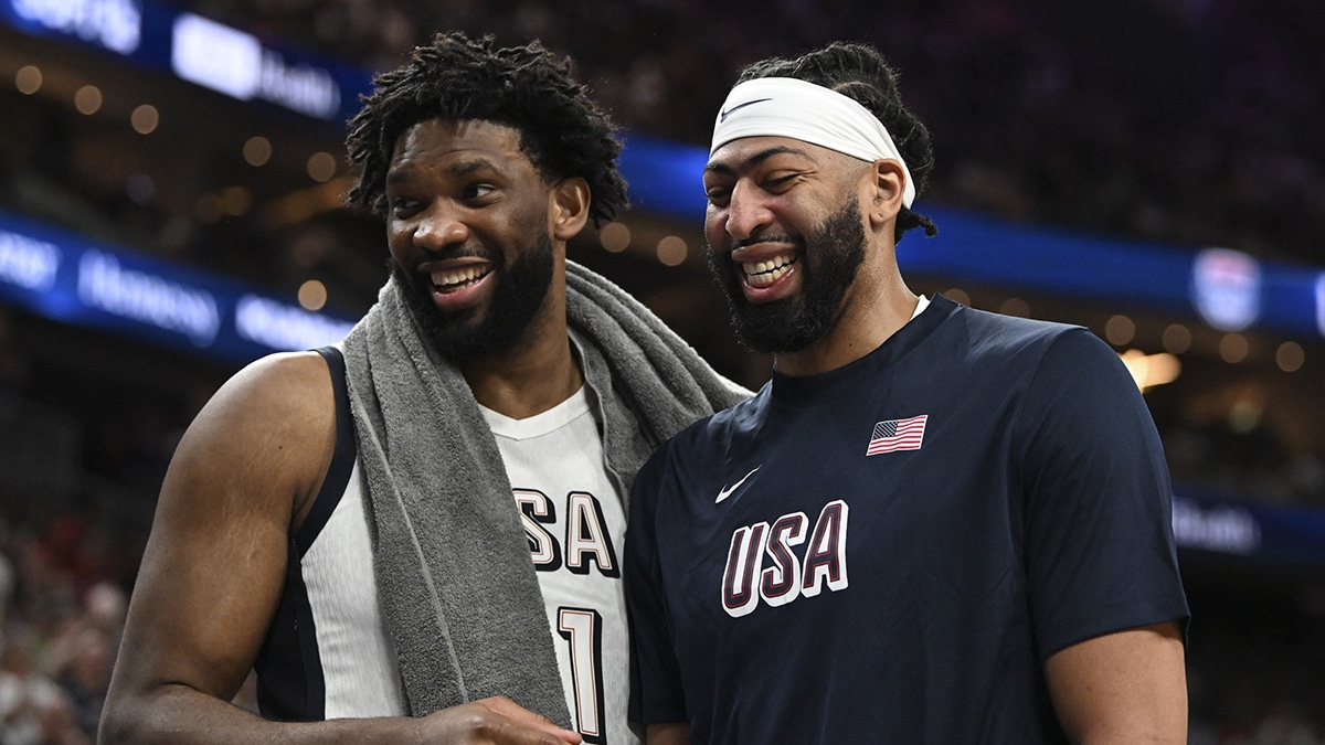 Joel Embiid (11) and forward Anthony Davis (14) laugh together