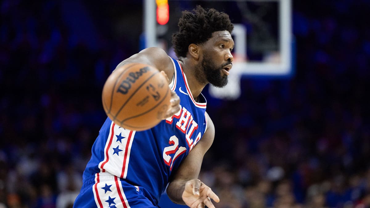 Philadelphia 76ers center Joel Embiid (21) passes the ball against the Toronto Raptors during the second quarter at Wells Fargo Center.