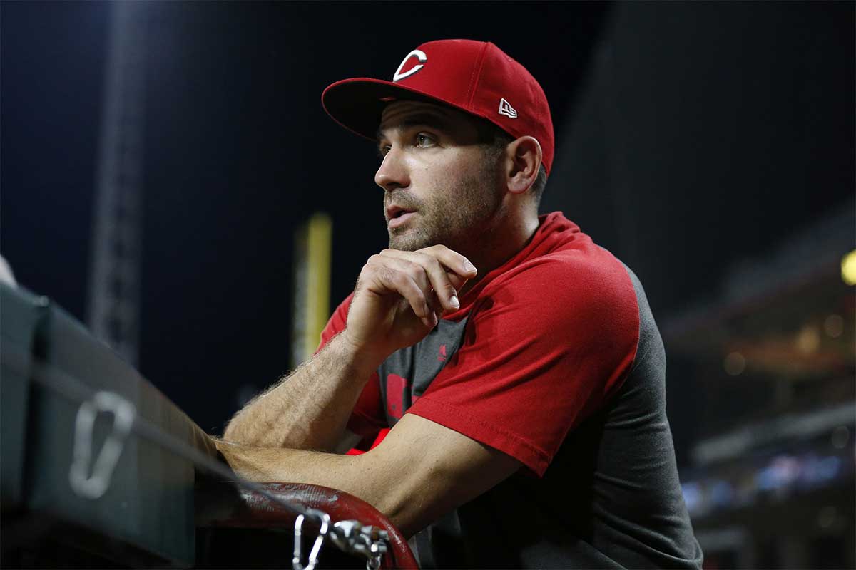 Injured Cincinnati Reds first baseman Joey Votto watches from the dugout in the seventh inning of the MLB National League game between the Cincinnati Reds and the San Diego Padres at Great American Ball Park in downtown Cincinnati on Monday, Aug. 19, 2019. The Padres won the series opener 3-2.