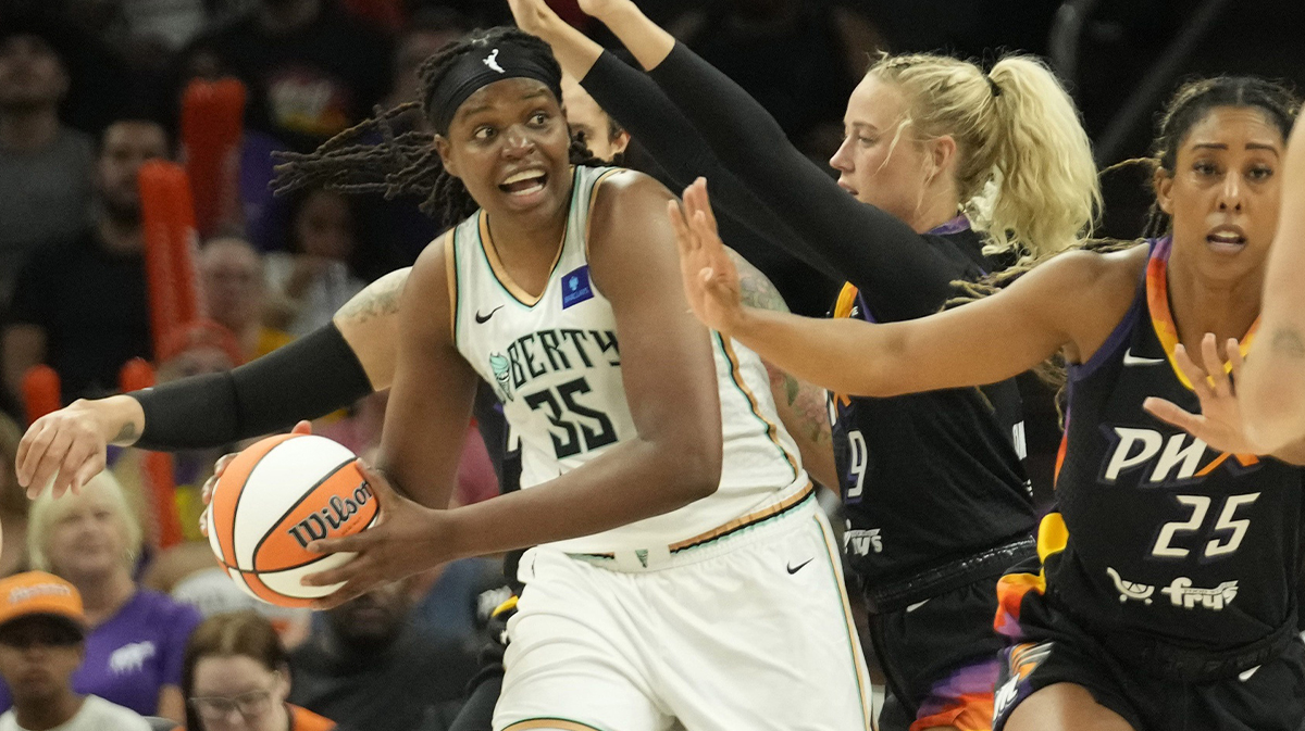 New York Liberty forward Jonquel Jones (35) looks to pass against Phoenix Mercury guard Sophie Cunningham (9) during the second quarter at Footprint Center on Aug. 26, 2024, in Phoenix.