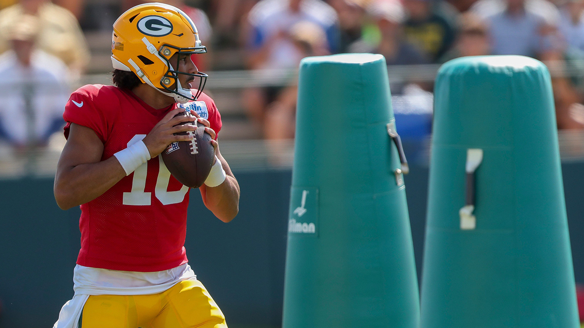 Green Bay Packers quarterback Jordan Love (10) runs through a drill during a joint practice with the Baltimore Ravens on Thursday, August 22, 2024, at Ray Nitschke Field in Ashwaubenon, Wis.