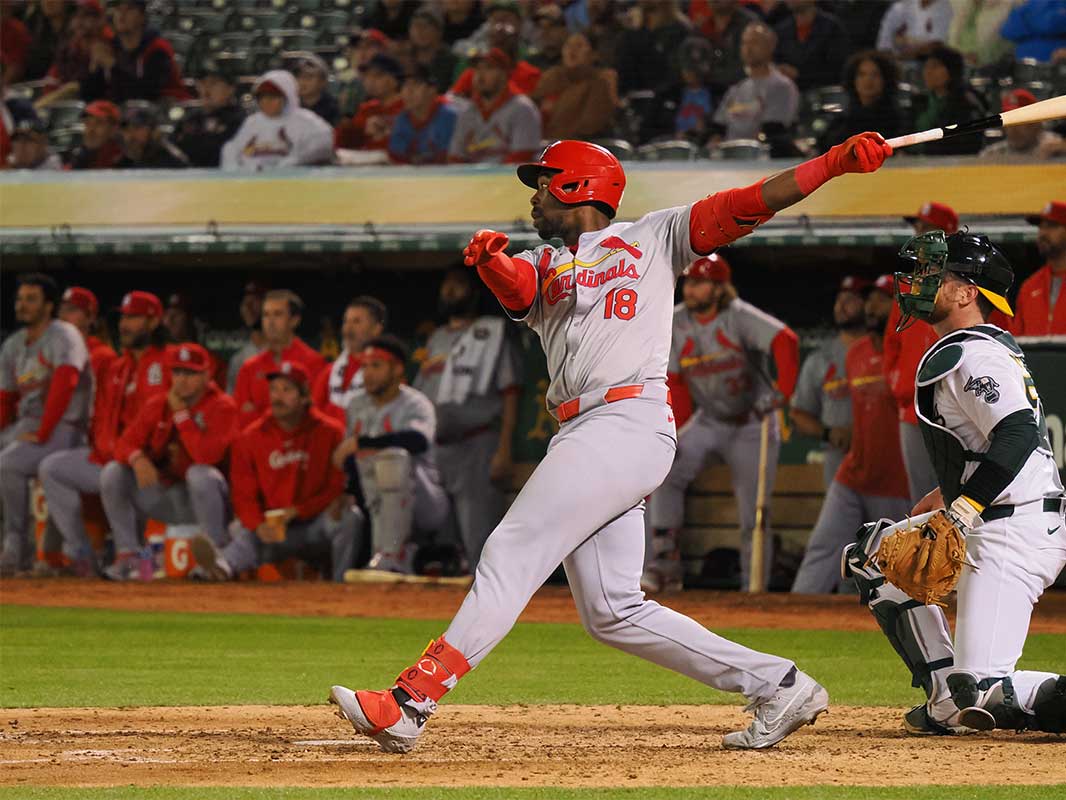 Apr 16, 2024; Oakland, California, USA; St. Louis Cardinals right fielder Jordan Walker (18) hits a sacrifice fly to score a run against the Oakland Athletics during the sixth inning at Oakland-Alameda County Coliseum. 