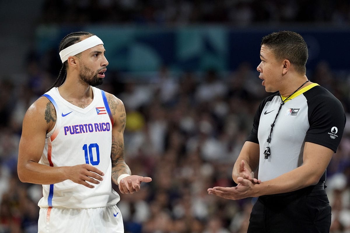 Puerto Rico point guard Jose Alvarado (10) talks to an official in the second quarter against Serbia during the Paris 2024 Olympic Summer Games at Stade Pierre-Mauroy.