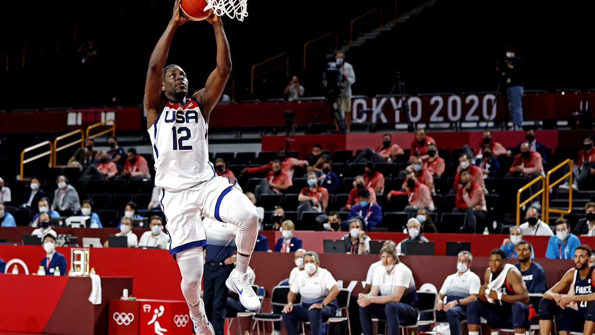 United States guard Jrue Holiday (12) dunks the ball against France in the men's basketball gold medal game during the Tokyo 2020 Olympic Summer Games at Saitama Super Arena.