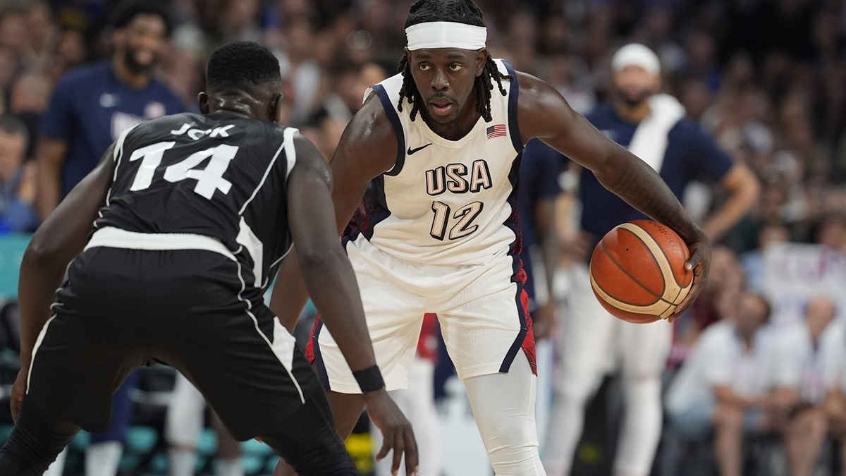 United States guard Jrue Holiday (12) dribbles against South Sudan shooting guard Peter Jok (14) in the fourth quarter during the Paris 2024 Olympic Summer Games at Stade Pierre-Mauroy. 