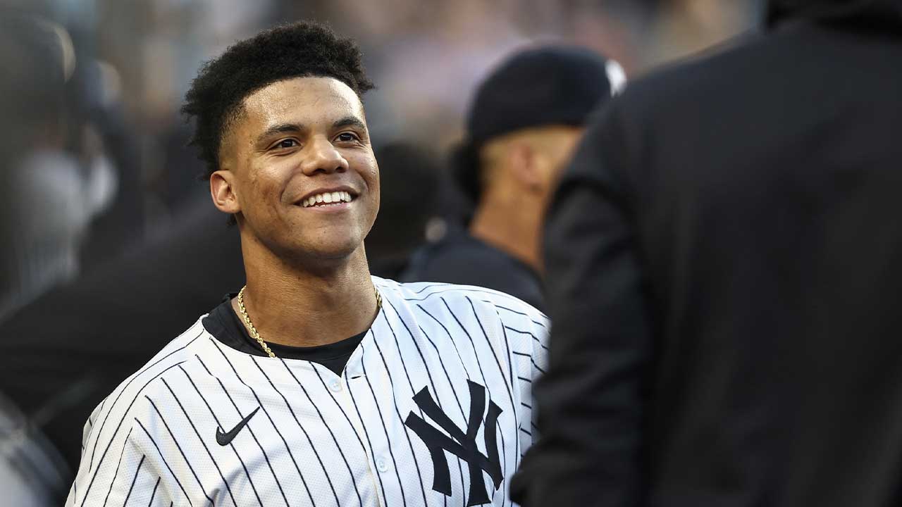 New York Yankees right fielder Juan Soto (22) celebrates in the dugout after hitting a two run home run in the first inning against the Cleveland Guardians at Yankee Stadium.
