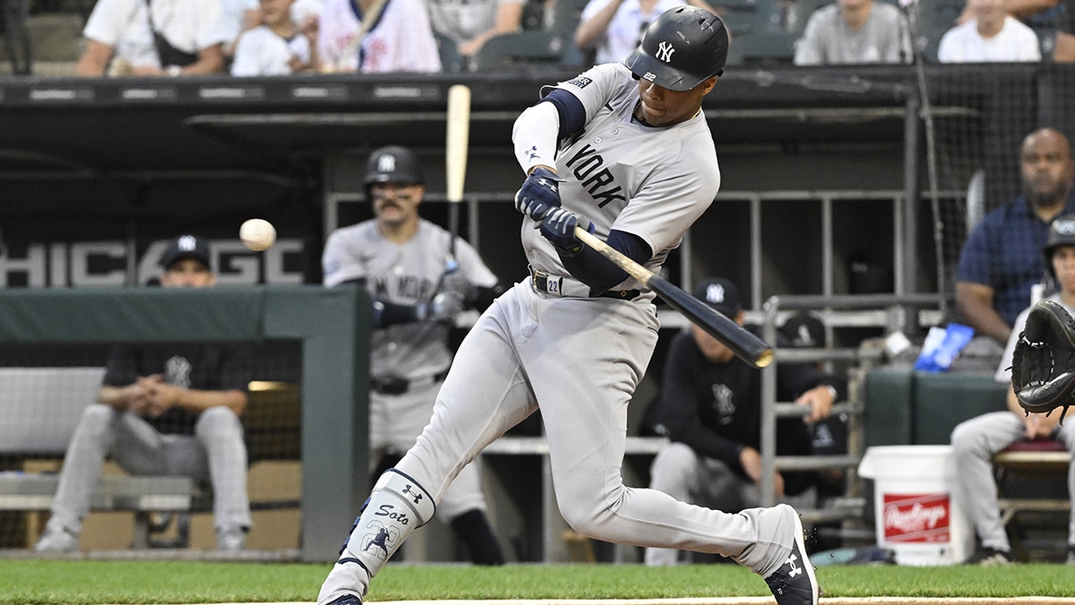 New York Yankees outfielder Juan Soto (22) hits a home run against the Chicago White Sox during the first inning at Guaranteed Rate Field