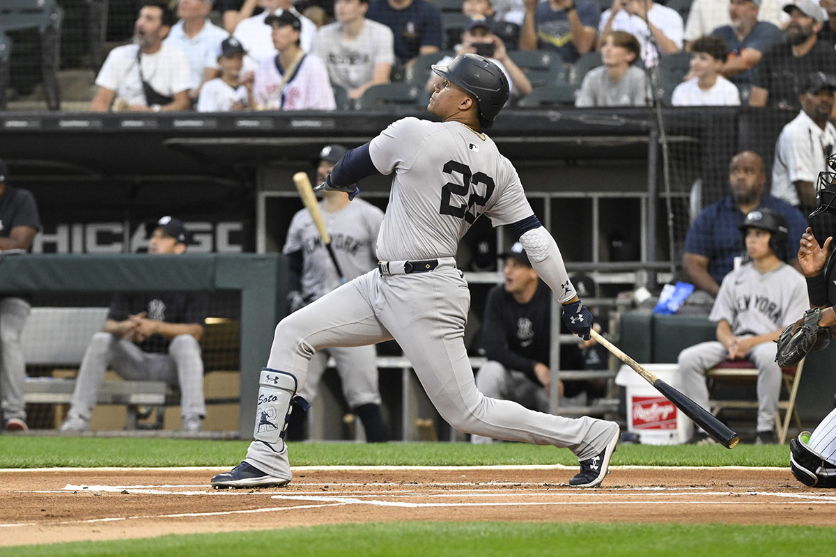 Aug 14, 2024; Chicago, Illinois, USA; New York Yankees outfielder Juan Soto (22) hits a home run against the Chicago White Sox during the first inning at Guaranteed Rate Field.