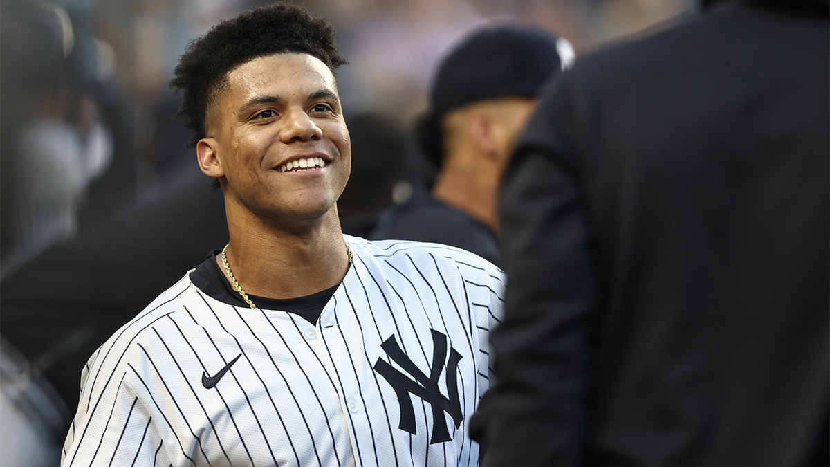 New York Yankees right fielder Juan Soto (22) celebrates in the dugout after hitting a two run home run in the first inning against the Cleveland Guardians at Yankee Stadium.