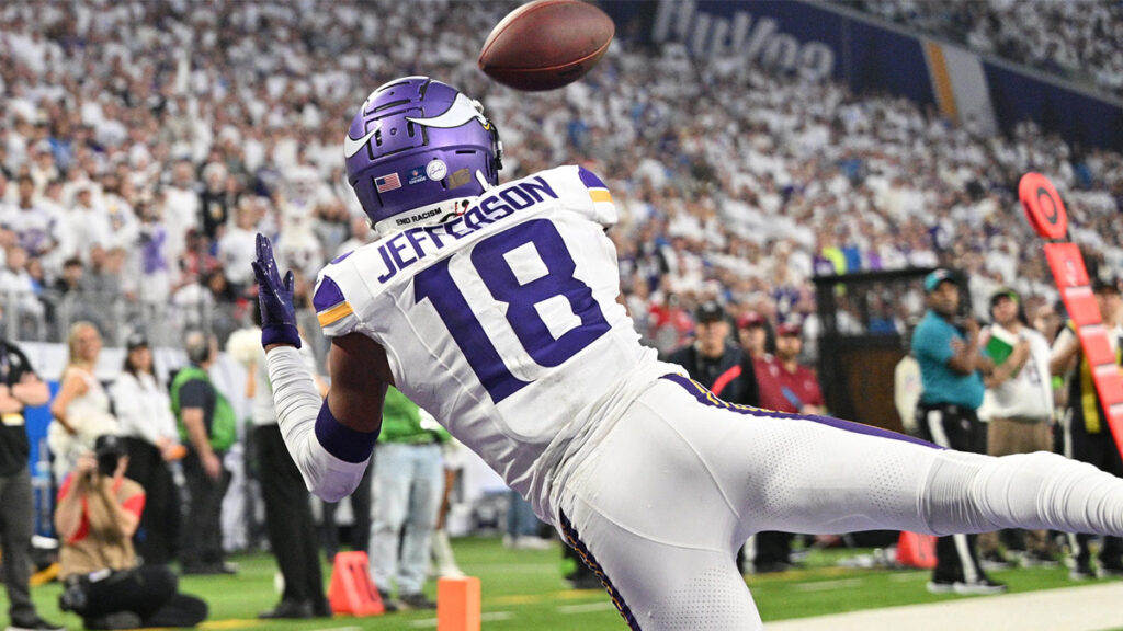 Minnesota Vikings wide receiver Justin Jefferson (18) catches a touchdown pass from quarterback Nick Mullens (not pictured) as Detroit Lions cornerback Cameron Sutton (1) defends during the second quarter at U.S. Bank Stadium.
