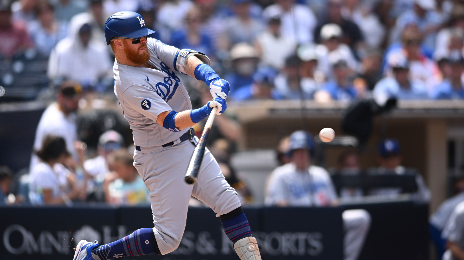 Sep 11, 2022; San Diego, California, USA; Los Angeles Dodgers third baseman Justin Turner (10) hits a home run against the San Diego Padres during the fifth inning at Petco Park.