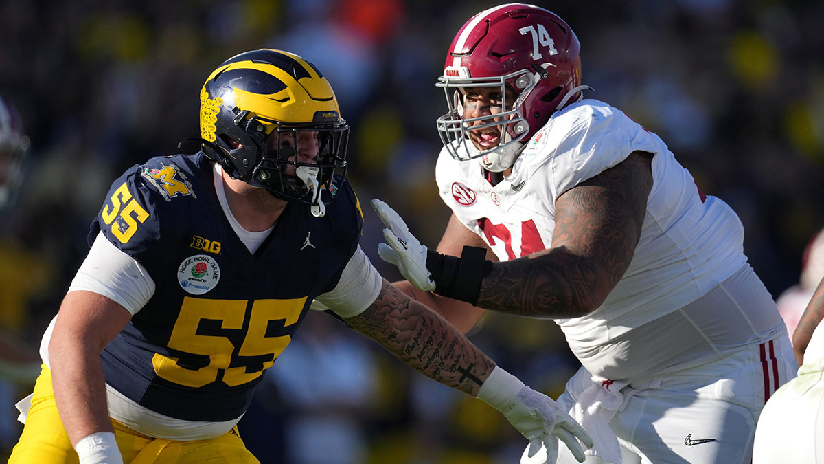 Alabama Crimson Tide offensive lineman Kadyn Proctor (74) blocks Michigan Wolverines defensive lineman Mason Graham (55) during the first half in the 2024 Rose Bowl college football playoff semifinal game at Rose Bowl.