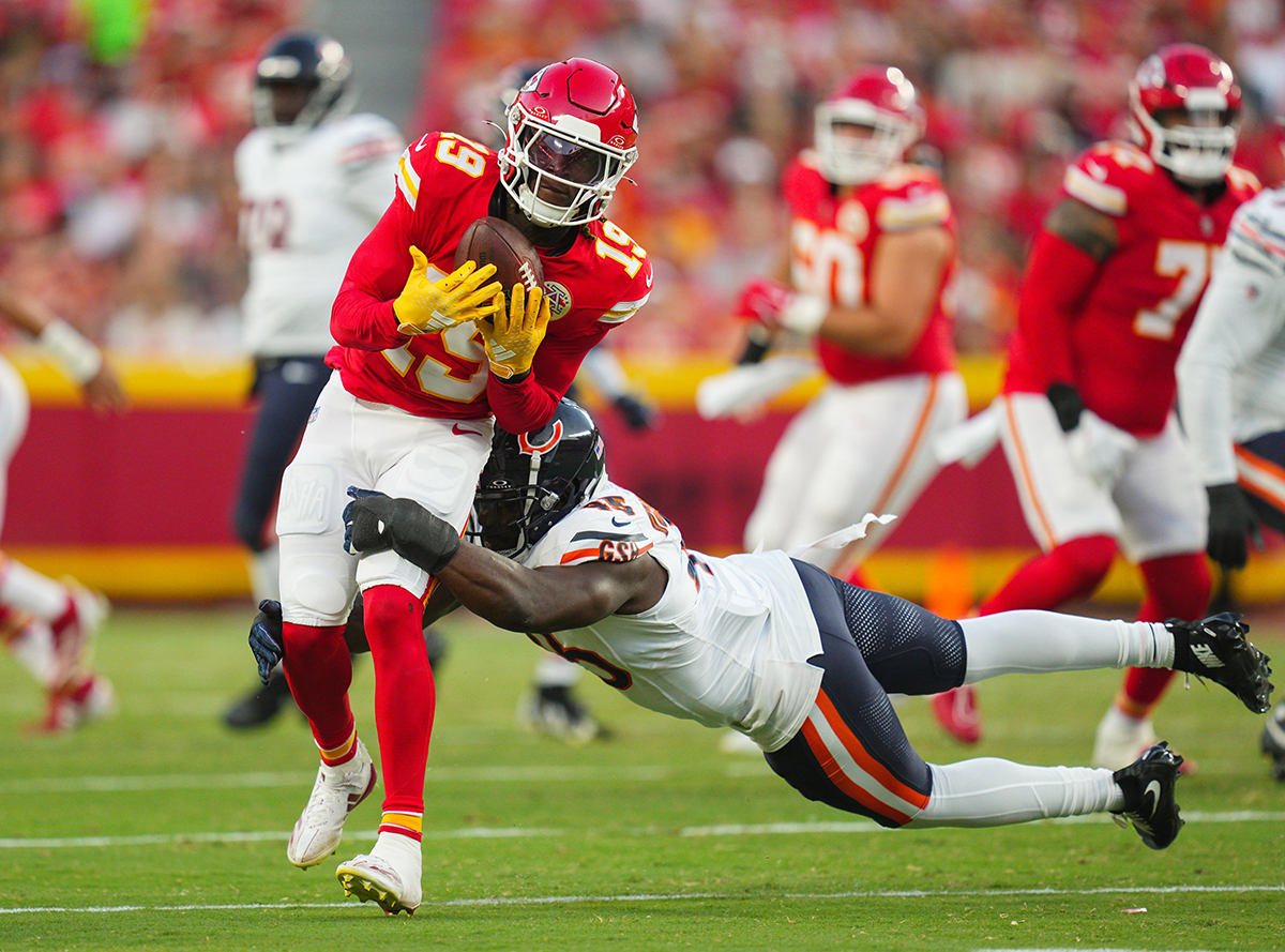 Kansas City Chiefs wide receiver Kadarius Toney (19) is tackled by Chicago Bears linebacker Amen Ogbongbemiga (45) during the first half at GEHA Field at Arrowhead Stadium. 