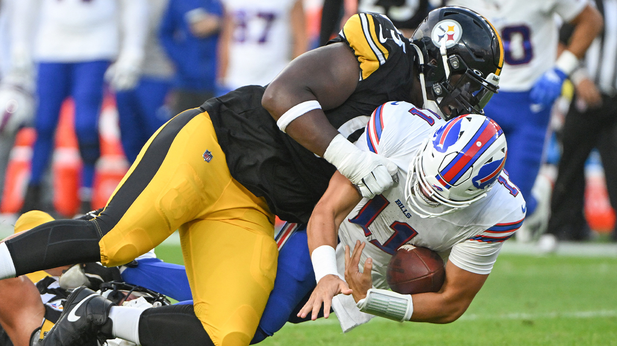Pittsburgh Steelers defensive tackle and Cam Heyward protege Keeanu Benton (95) sacks Buffalo Bills quarterback Mitchell Trubisky (11) during the first quarter at Acrisure Stadium.