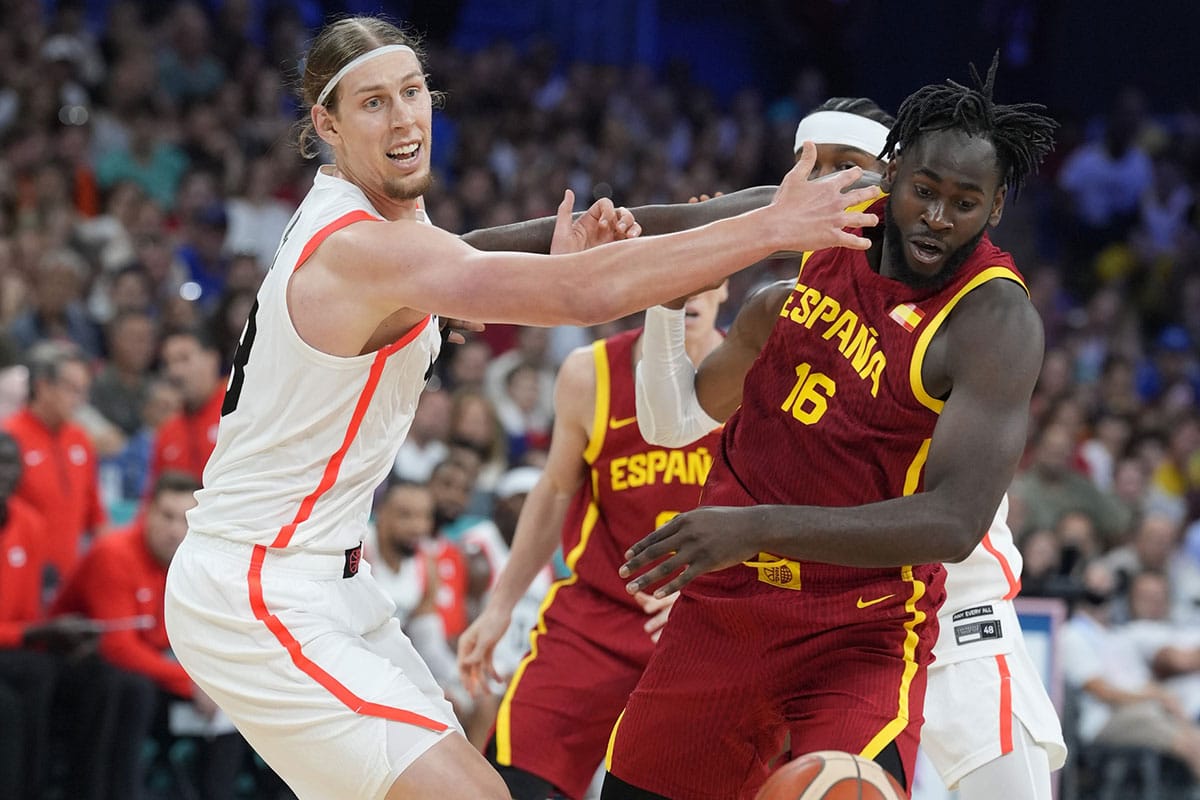 Canada forward Kelly Olynyk (13) defends against Spain forward Usman Garuba (16) in the first half in a men’s group A basketball game during the Paris 2024 Olympic Summer Games at Stade Pierre-Mauroy.