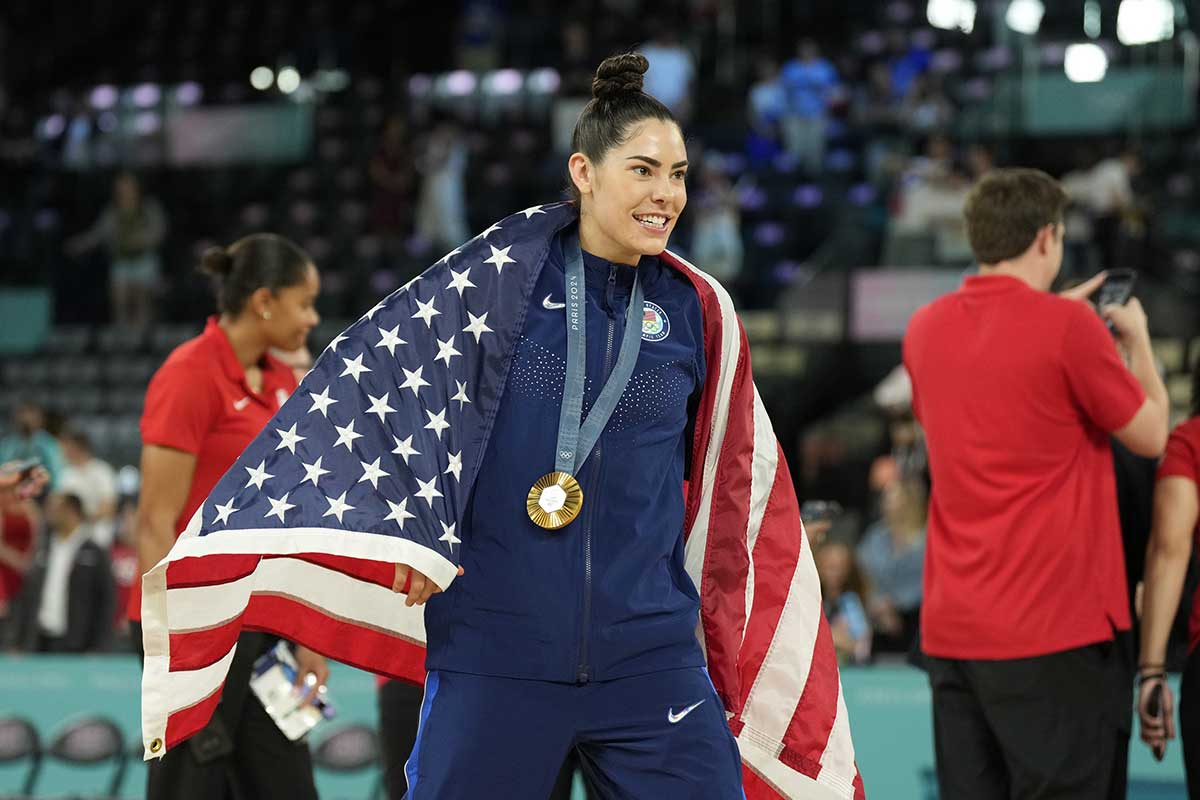 United States guard Kelsey Plum (5) celebrates after defeating France in the women's gold medal game during the Paris 2024 Olympic Summer Games at Accor Arena.
