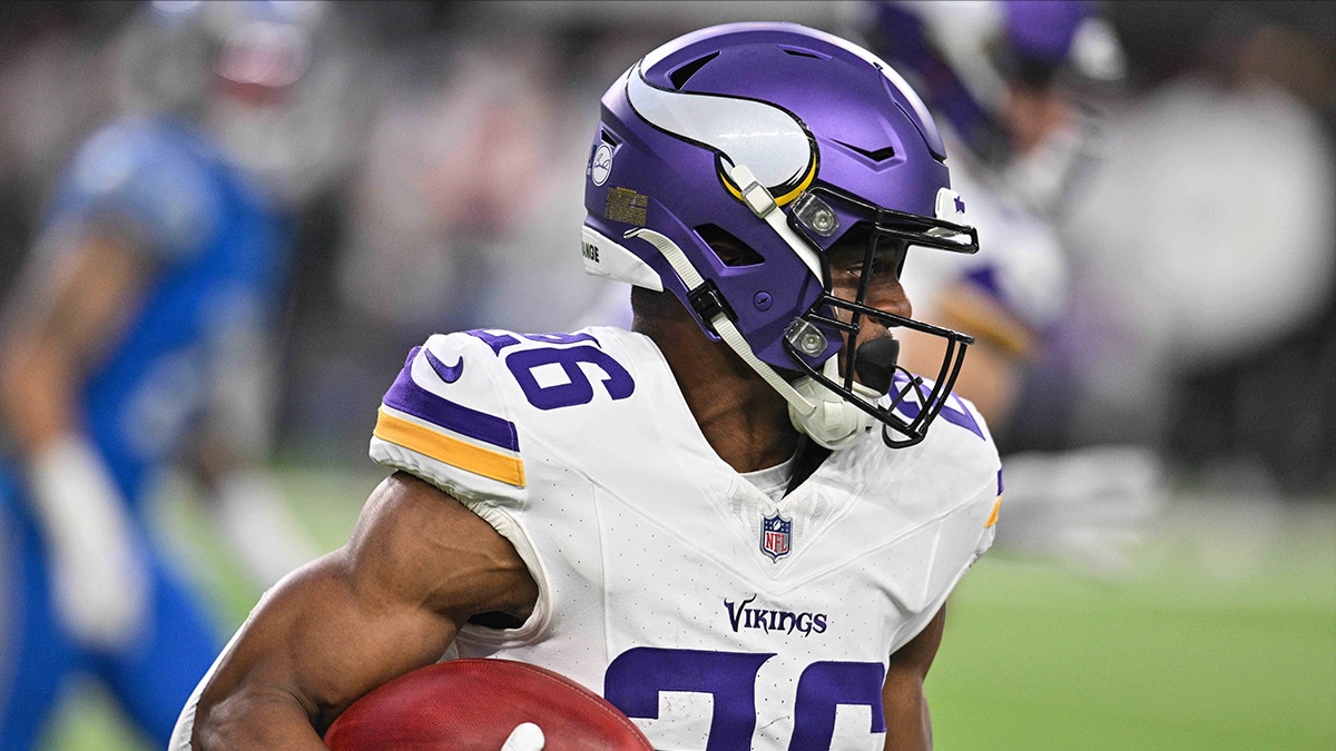 Minnesota Vikings running back Kene Nwangwu (26) returns a kickoff against the Detroit Lions during the game at U.S. Bank Stadium. 