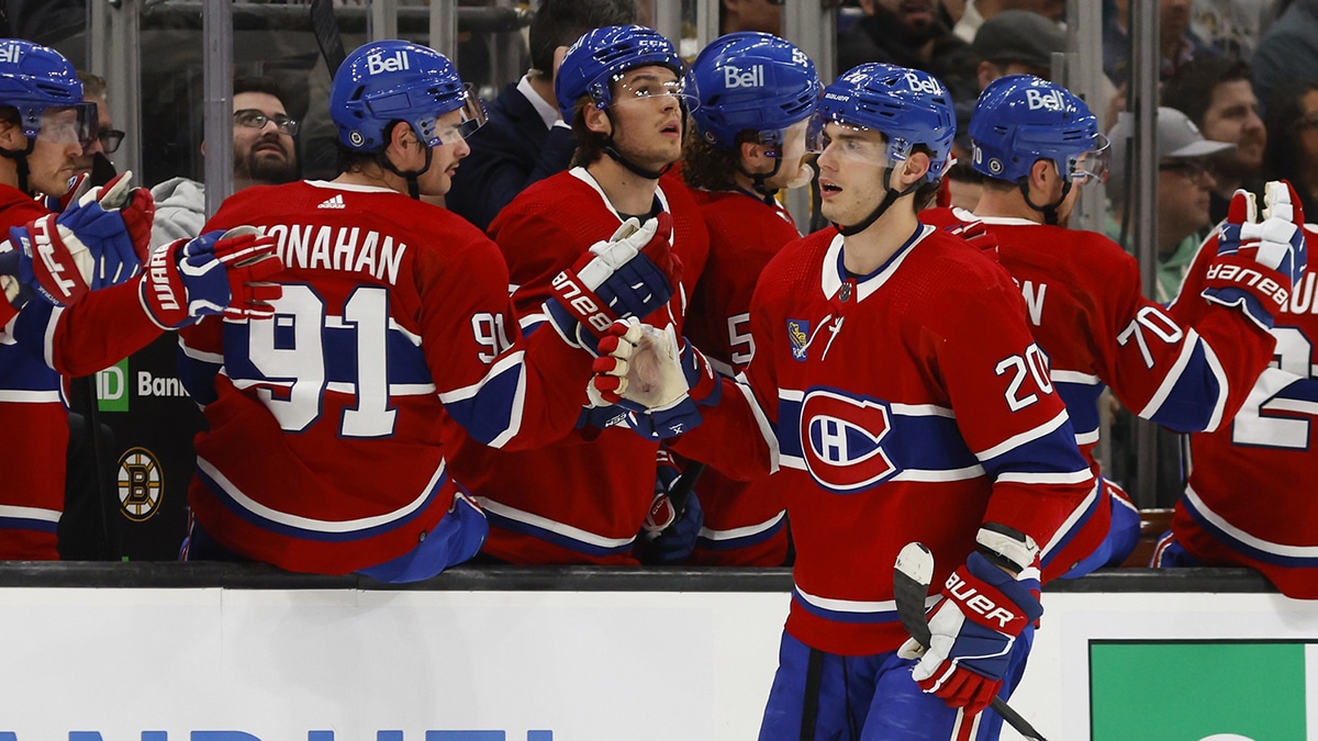 Montreal Canadiens left wing Juraj Slafkovsky (20) is congratulated at the bench after scoring against the Boston Bruins during the second period at TD Garden.