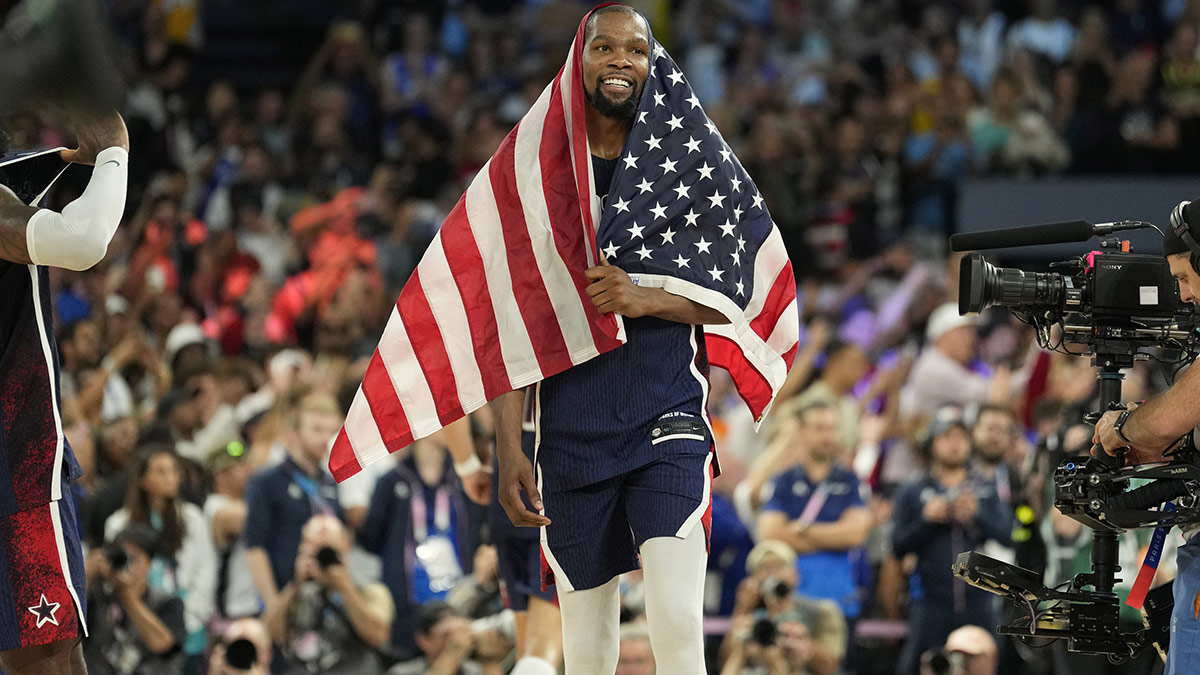 United States guard Kevin Durant (7) celebrates after defeating France in the men's basketball gold medal game during the Paris 2024 Olympic Summer Games at Accor Arena.