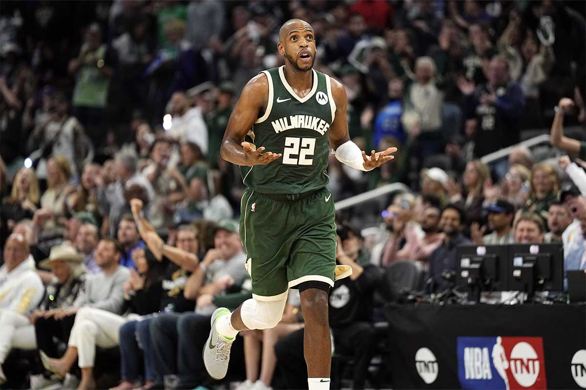 Milwaukee Bucks forward Khris Middleton (22) reacts after scoring a basket during the fourth quarter against the Indiana Pacers during game five of the first round for the 2024 NBA playoffs at Fiserv Forum.