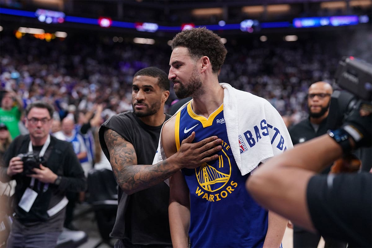 Golden State Warriors guard Klay Thompson (11) and guard Gary Payton II (0) walk towards the locker room after the Warriors lost to the Sacramento Kings during a play-in game of the 2024 NBA playoffs at the Golden 1 Center.