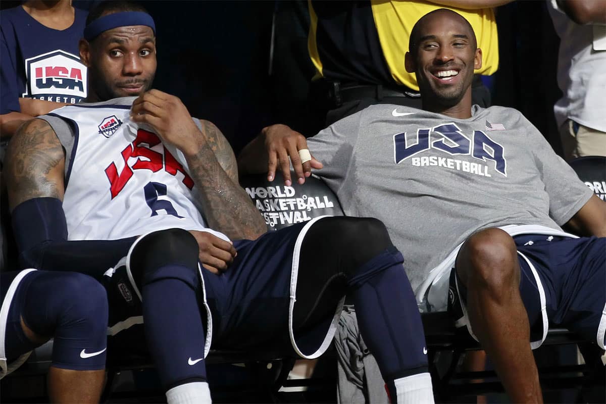 July 14, 2012; Washington, DC, USA; United States guard LeBron James (6) and United States forward Kobe Bryant (10) smile on the sidelines during USA team training at the DC Armory